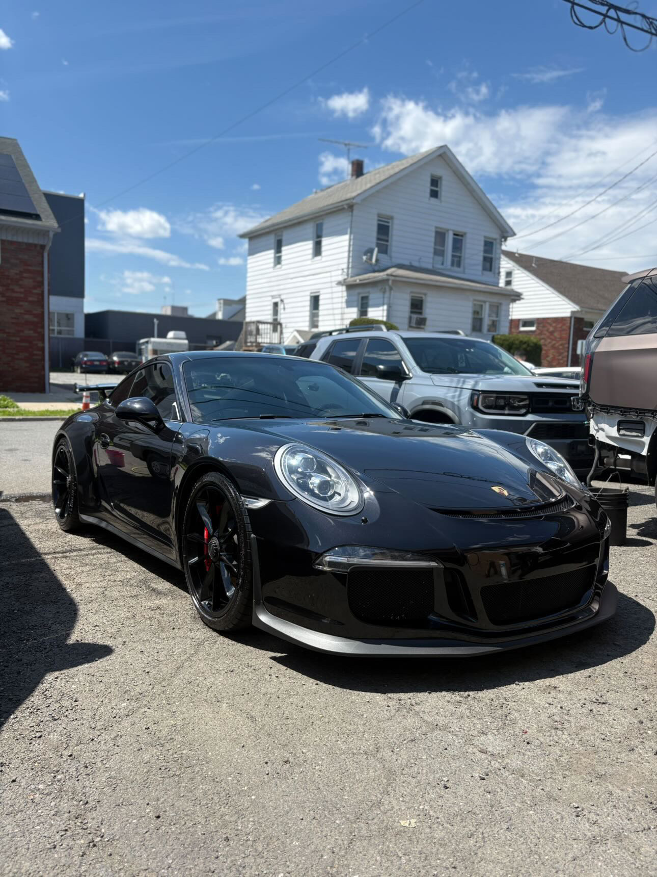 Black Porsche 911 GT3 finished with deep mirror gloss after detail