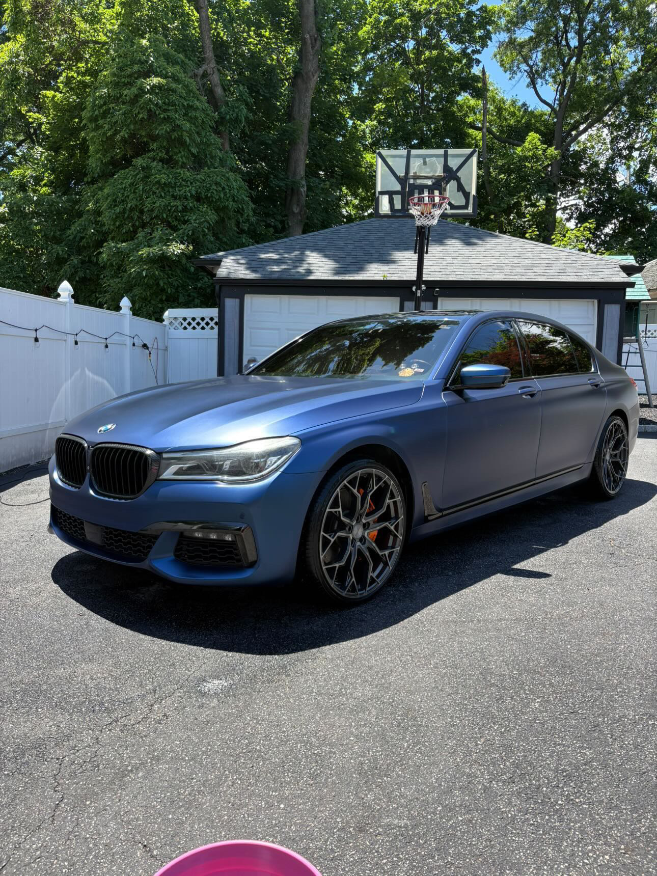 Frozen blue metallic BMW 7 Series gleaming after full detail