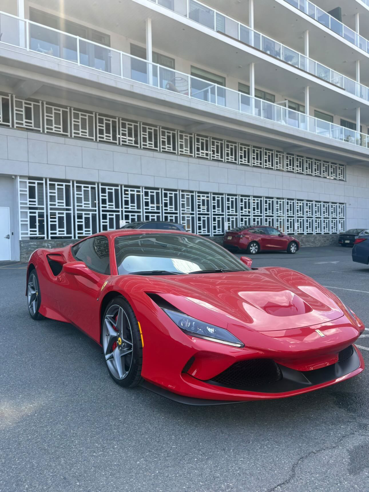 Red Ferrari F8 Tributo gleaming with deep mirror gloss after full detail